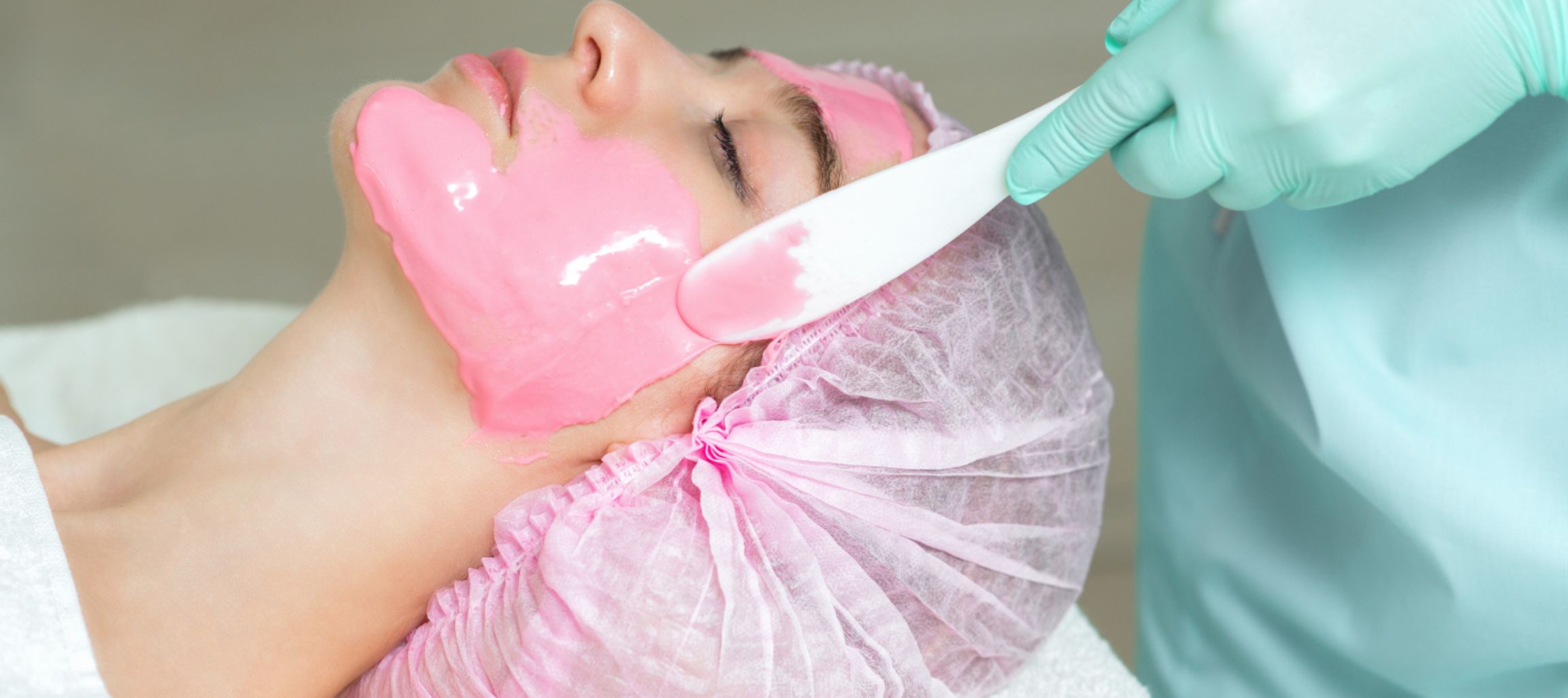 Lady getting skin care treatment on her face